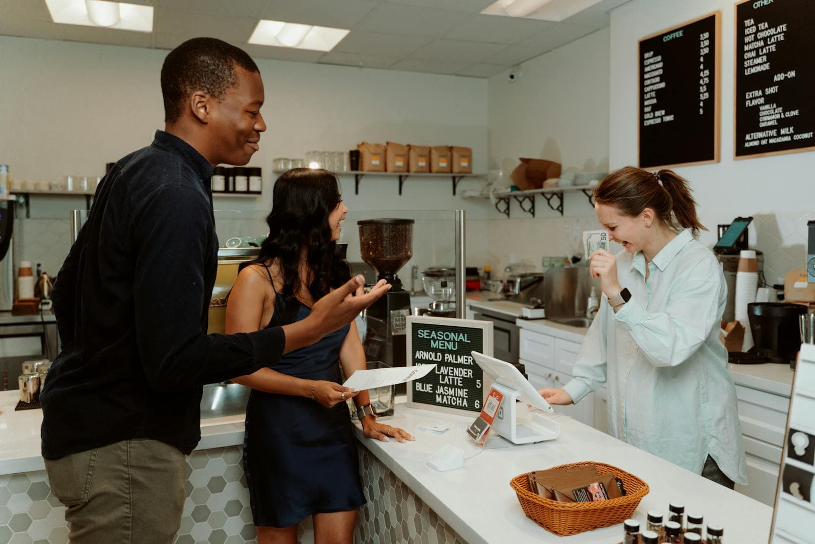 Restaurant owner chatting with customers at the counter