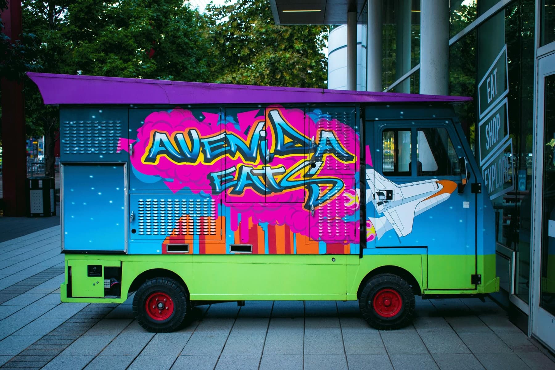 Vibrant graffiti food truck parked on the street