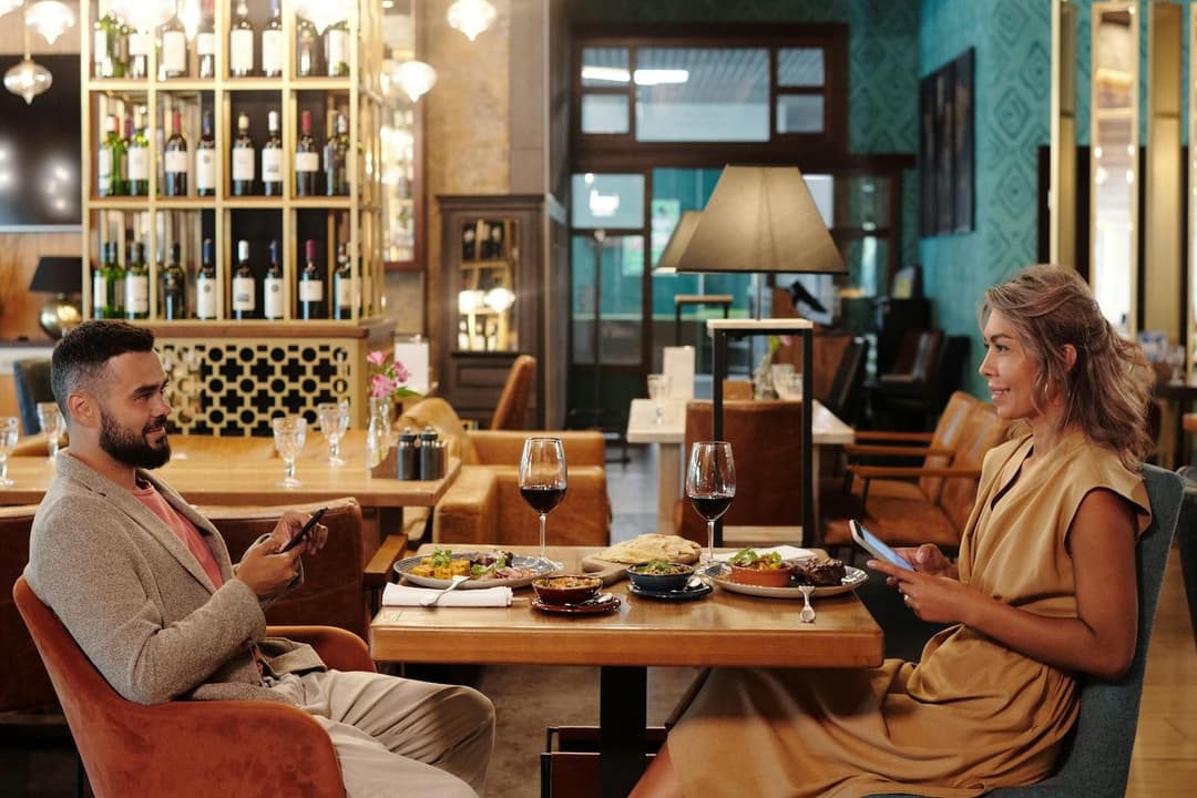 Couple sharing dinner at a warm full-service restaurant