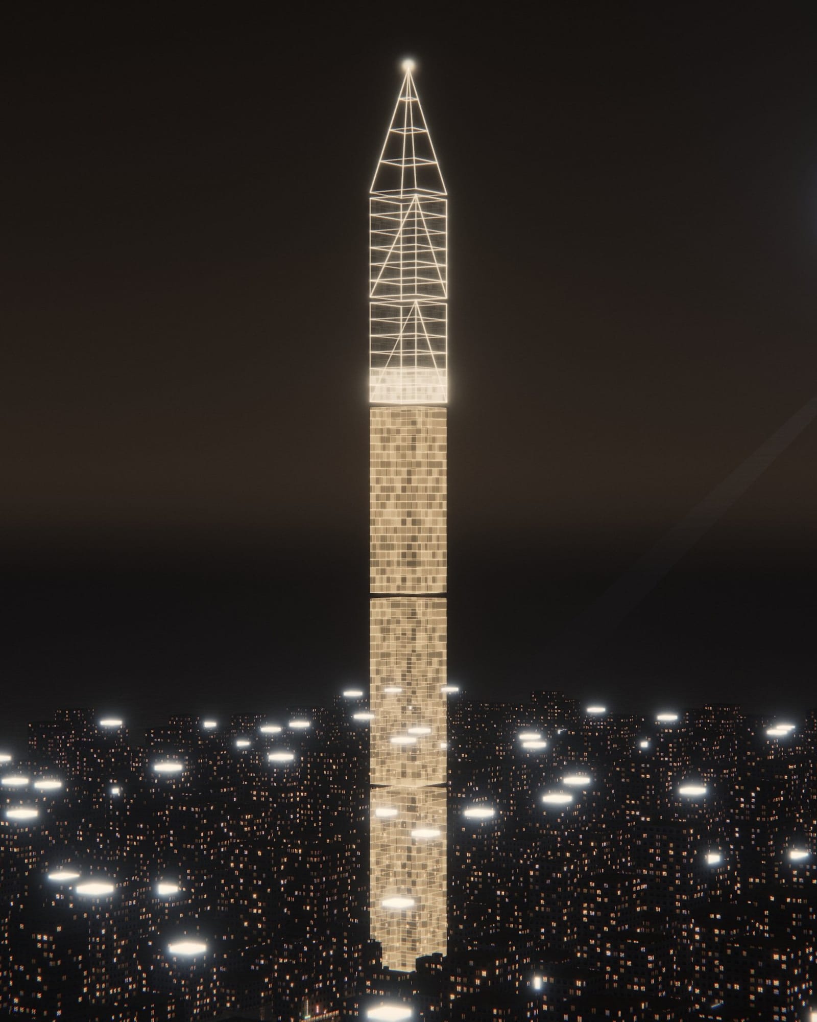 A gold tower standing over a city of lit windows at night.